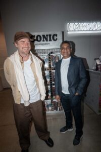 Hemal Sheth and attendees holding the Highsnobiety Fall 2025 issue during the Grand Street pop-up.