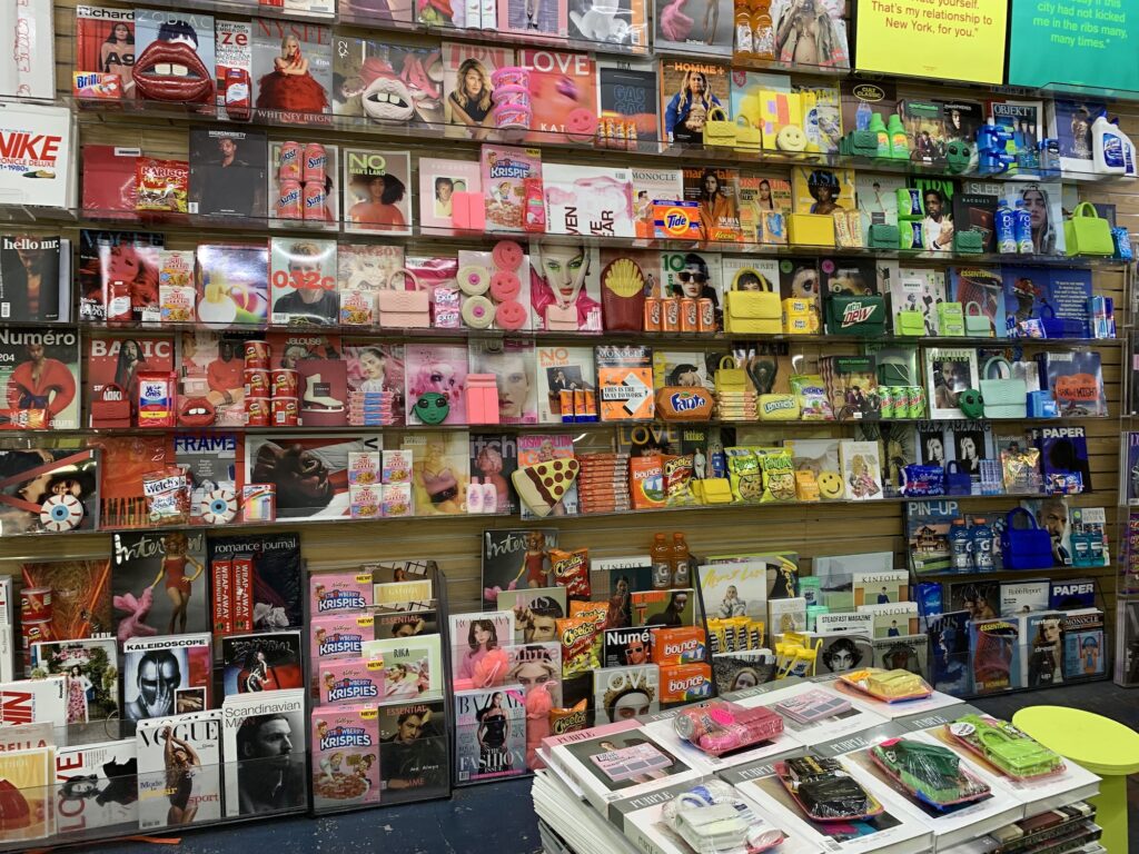 wall filled with rainbow products as part of gelareh mizrahi launch at iconic magazine