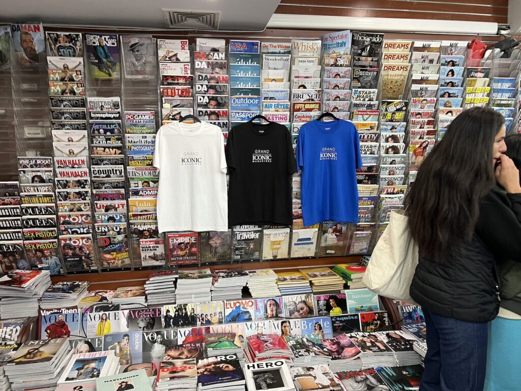 t-shirts hanging inside a paper trail launch at iconic magazines