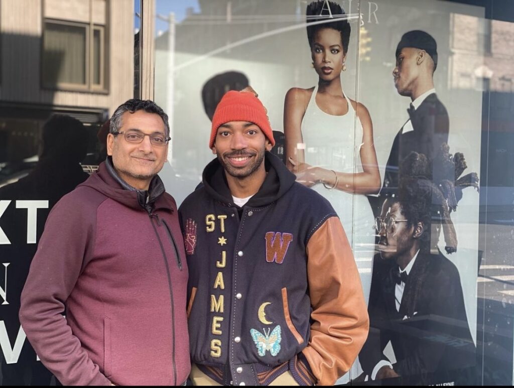 Hemal Sheth and Black Fashion Fair founder Antoine Grégory in front of the Volume 0: SEEN campaign window.