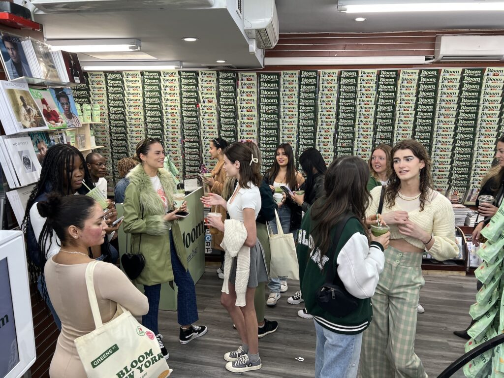Bloom Nutrition displays covering the walls above the magazine racks during the New York pop-up.