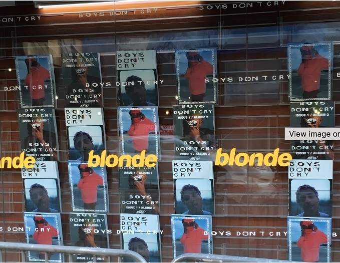 Alternate Boys Don’t Cry covers and Blonde graphics in the storefront window.