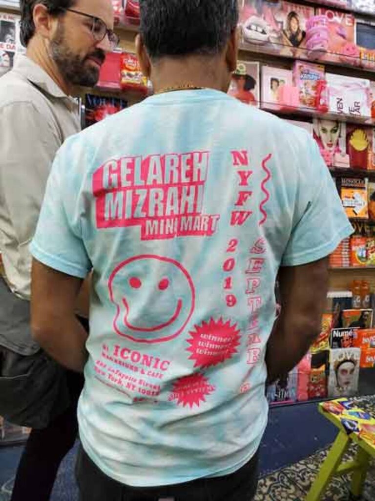 back of t-shirt that says gelareh mixrahi mini mart NYFW with smiley face