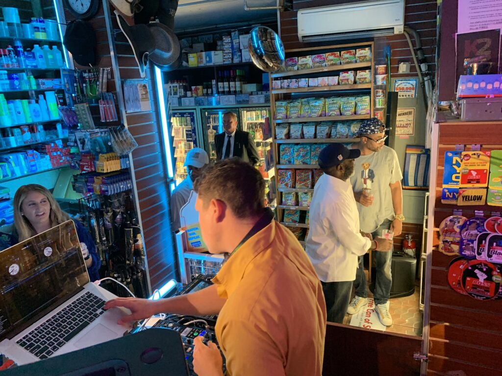 DJ performing beside the magazine racks during the AriZona launch party