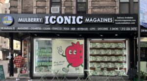 Bloom Nutrition New York pop-up takeover at Iconic Magazines, Mulberry Street, with a strawberry mascot and product-filled windows.