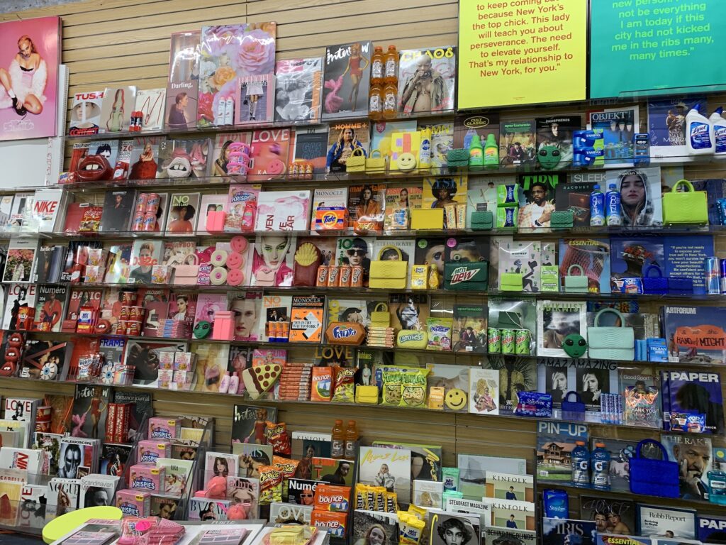wall filled with rainbow products as part of gelareh mizrahi launch at iconic magazine