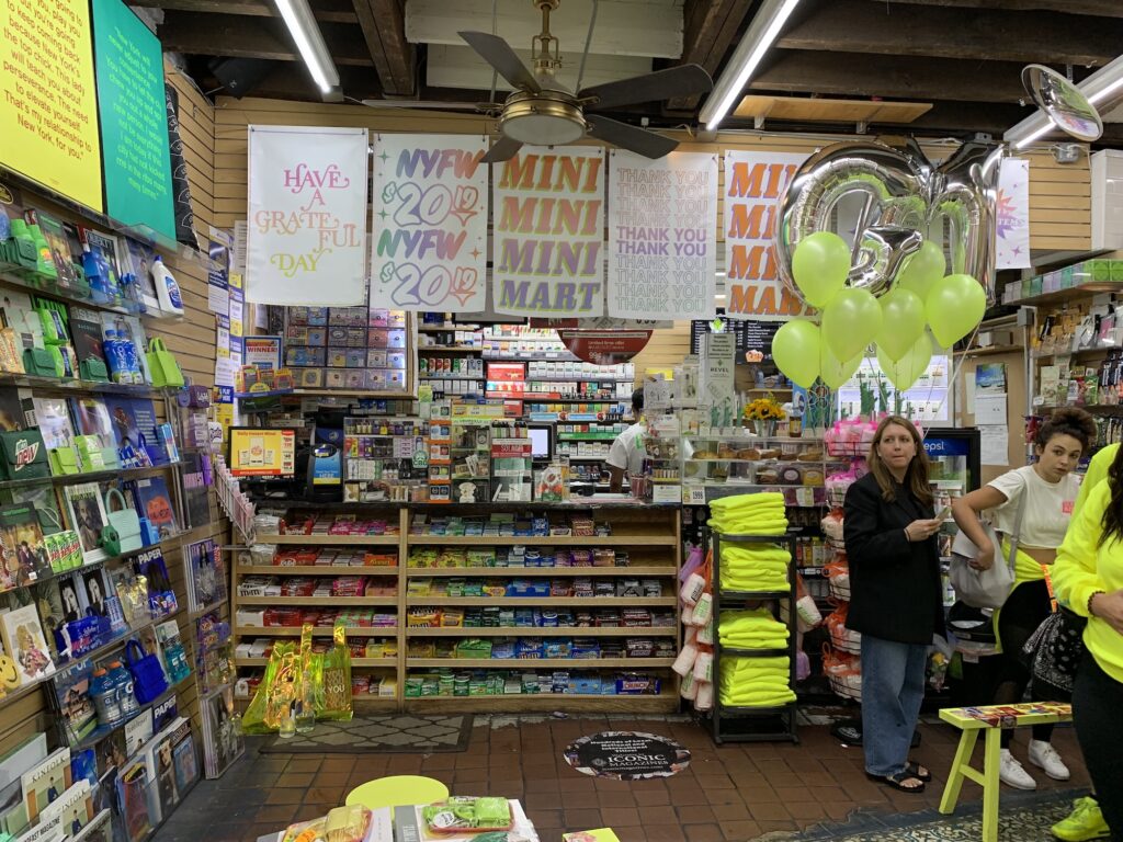 front of store for gelerah mizrahi event at conic magazine. candy magazines and tees throughout
